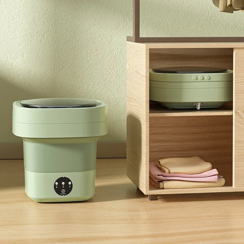 Compact folding washing machine for small spaces and travel, featuring a lightweight, portable design with powerful cleaning capabilities
