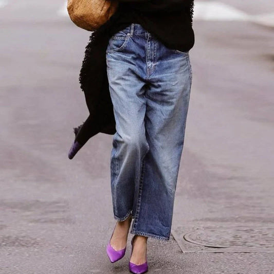Straight leg denim trousers in light blue with a loose fit and mid-waist design