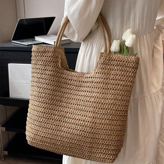 A stylish and spacious straw tote bag in brown and beige colours, perfect for British women on the go.
