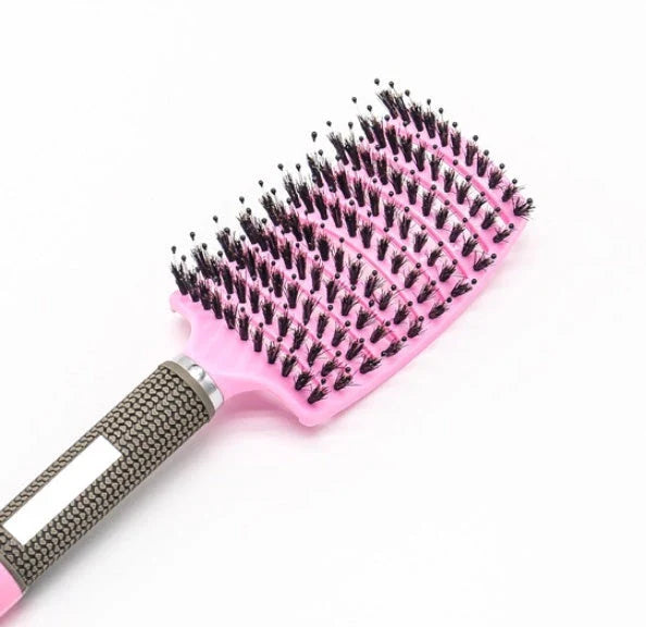 A premium hair brush with a sleek design, featuring soft bristles and a rounded massage function for healthy, detangled hair