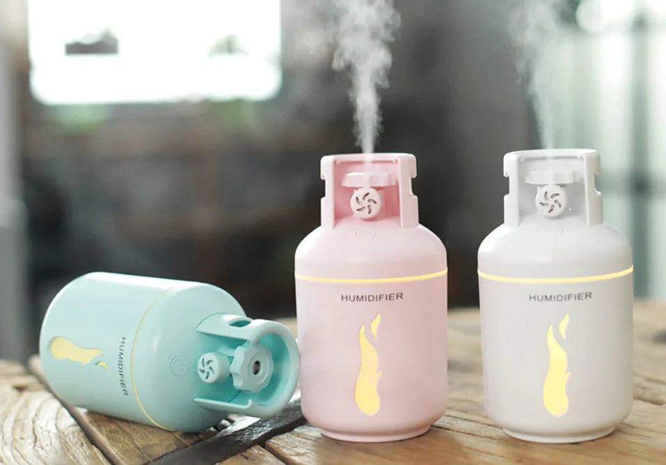 Multifunctional gas tank humidifier with USB connectivity in pink, blue, and white