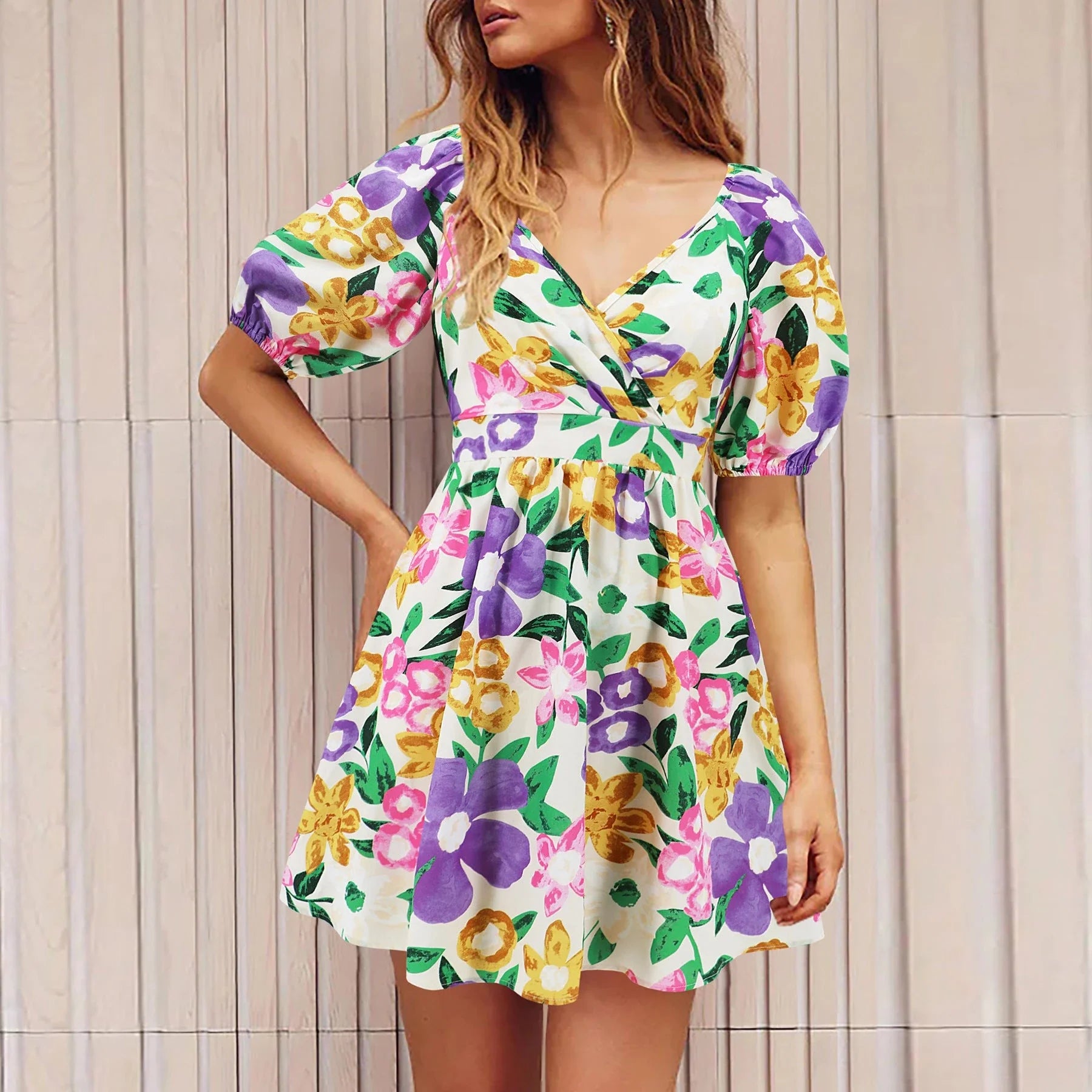 Stylish floral dress with V-neck and lantern sleeves, perfect for summer vacations and warm-weather occasions