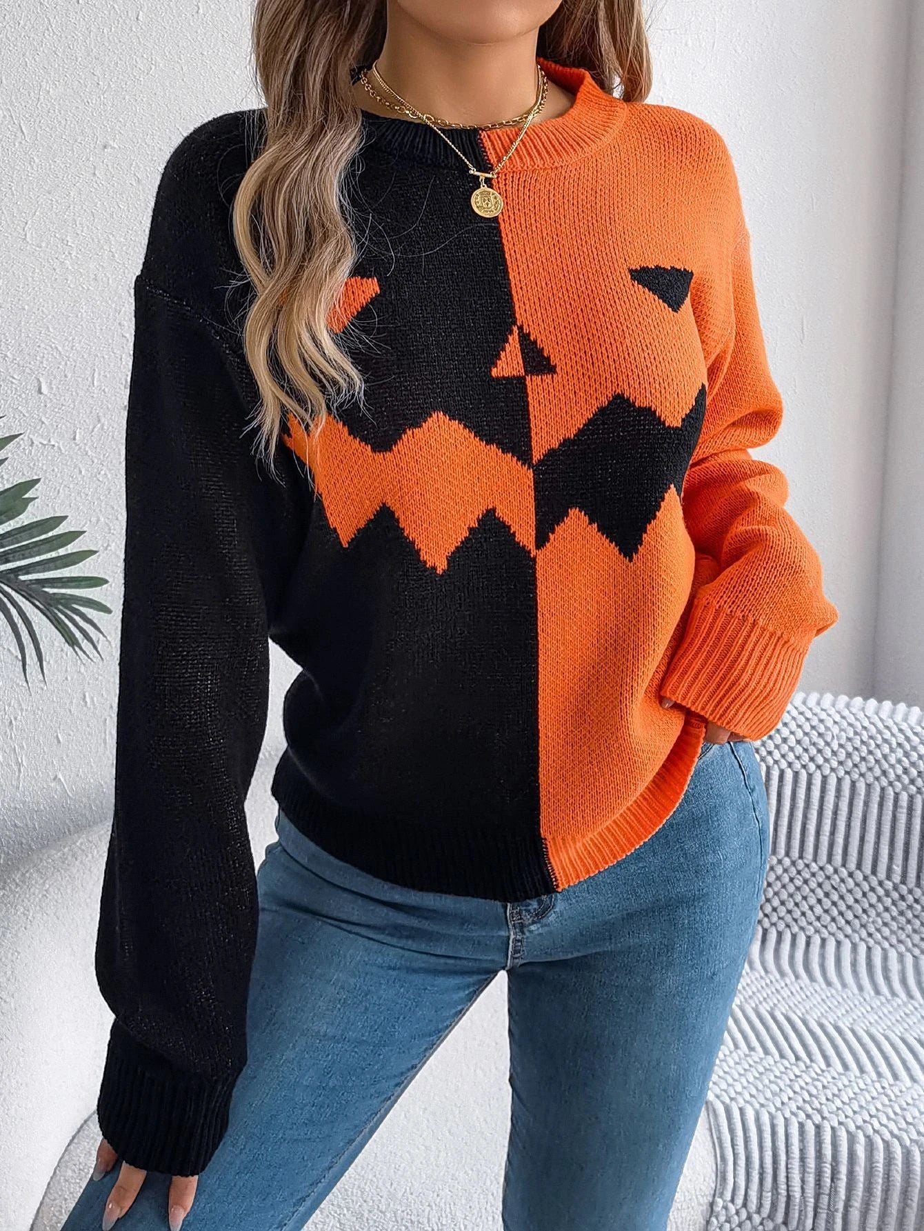 A stylish Halloween pullover sweater with a ghost motif, available in a variety of vibrant colors and sizes.