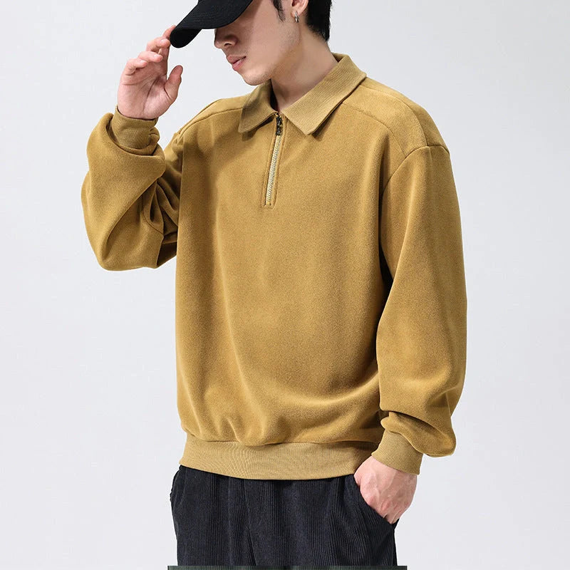 Premium fleece half-zip hoodie in black, haze green, and apricot yellow colours, featuring a tailored design and ribbed details for a refined look.