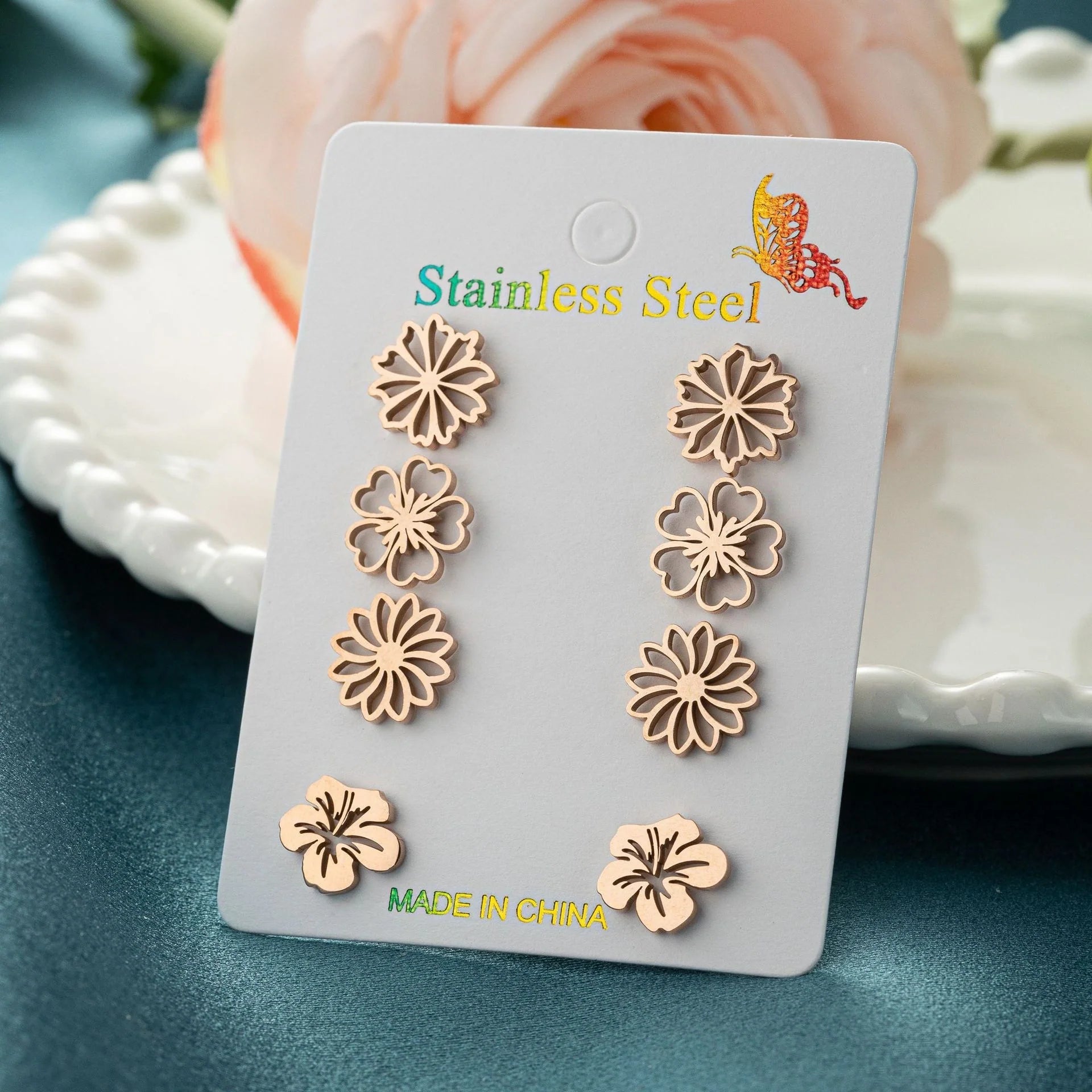Fashion simulation stud earrings in gold, steel, rose gold, and black