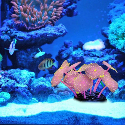 Artificial blue silicone coral decorating an aquarium with lush underwater plants and vibrant fish