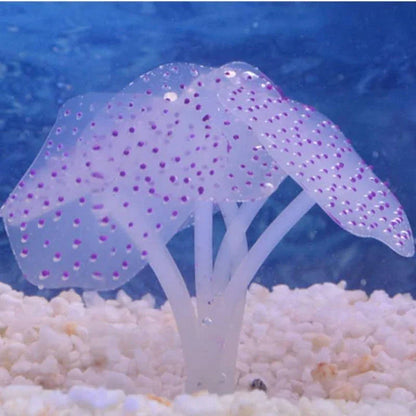 Artificial blue silicone coral decorating an aquarium with lush underwater plants and vibrant fish