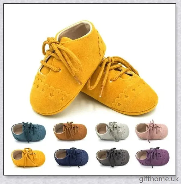 A pair of stylish and comfortable 0-1 year old baby toddler shoes with soft soles in a multicolour design