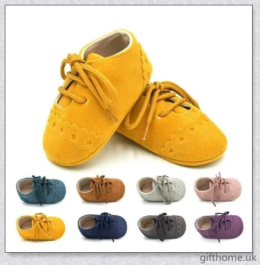 A pair of stylish and comfortable 0-1 year old baby toddler shoes with soft soles in a multicolour design