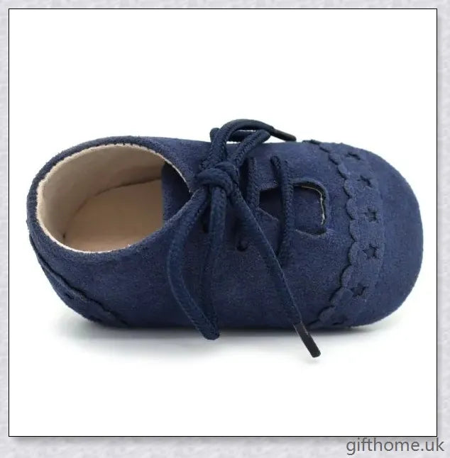 A pair of stylish and comfortable 0-1 year old baby toddler shoes with soft soles in a multicolour design