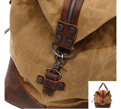 A large, khaki-coloured canvas crossbody luggage bag with multiple pockets and compartments for organised travel
