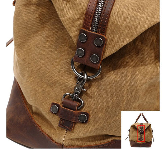 A large, khaki-coloured canvas crossbody luggage bag with multiple pockets and compartments for organised travel