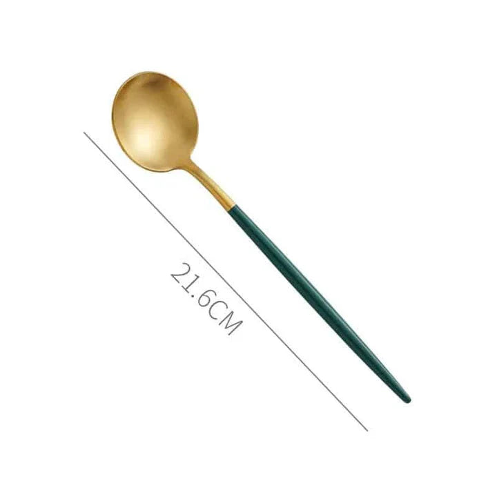A set of minimalist, eco-friendly tableware in green and gold tones, including plates, bowls, and utensils.