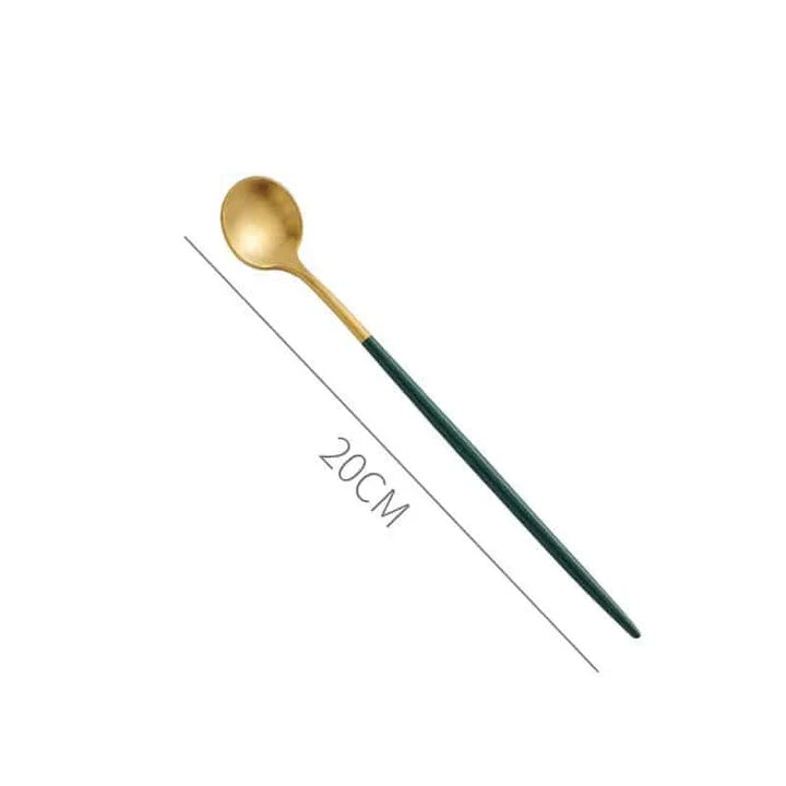 A set of minimalist, eco-friendly tableware in green and gold tones, including plates, bowls, and utensils.