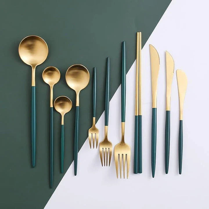 A set of minimalist, eco-friendly tableware in green and gold tones, including plates, bowls, and utensils.