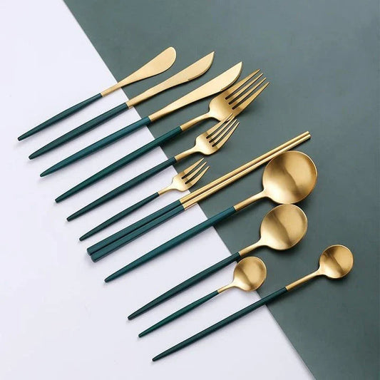 A set of minimalist, eco-friendly tableware in green and gold tones, including plates, bowls, and utensils.