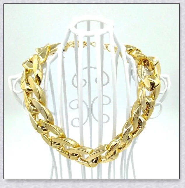 Thick gold chain dog collar with a stylish and durable design, perfect for adding a touch of urban sophistication to your pet's look.