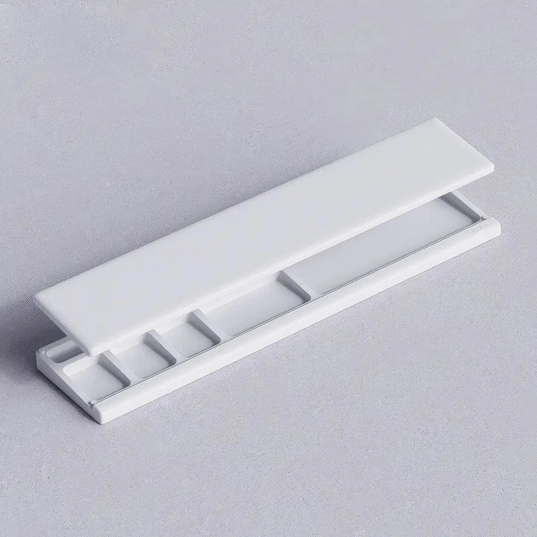 Ergonomic keyboard wrist rest pad with integrated desktop storage for organised workspace