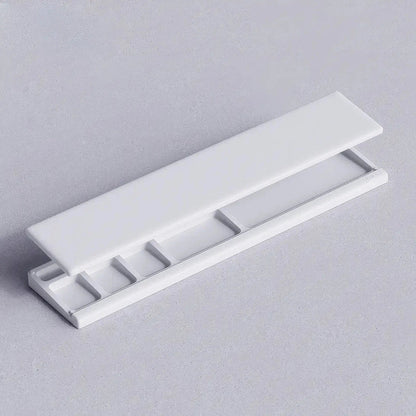 Ergonomic keyboard wrist rest pad with integrated desktop storage for organised workspace