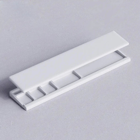 Ergonomic keyboard wrist rest pad with integrated desktop storage for organised workspace