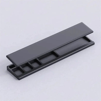 Ergonomic keyboard wrist rest pad with integrated desktop storage for organised workspace
