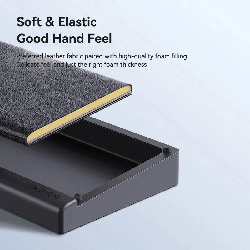 Ergonomic keyboard wrist rest pad with integrated desktop storage for organised workspace