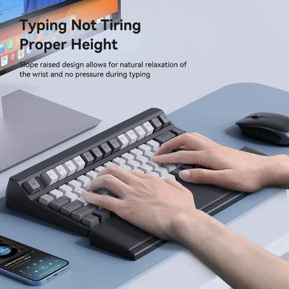 Ergonomic keyboard wrist rest pad with integrated desktop storage for organised workspace