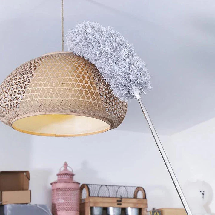 Extendable microfiber duster with long stainless steel handle for reaching high areas and cleaning ceiling fans, light fixtures, and tall furniture