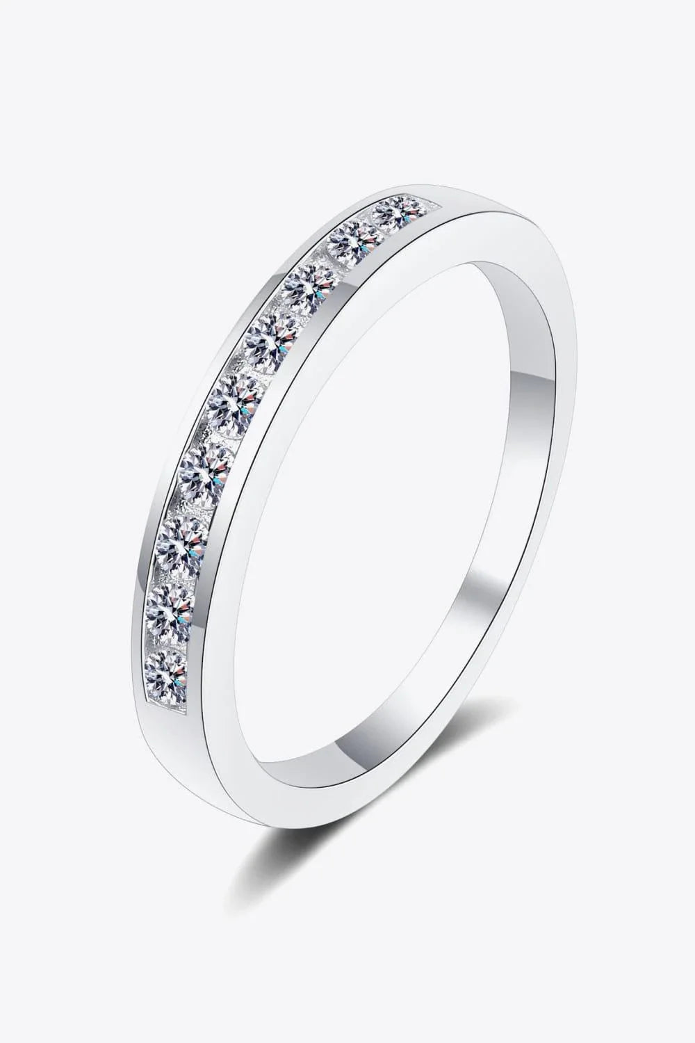 A modern, minimalist 925 sterling silver ring featuring a sparkling moissanite centre stone