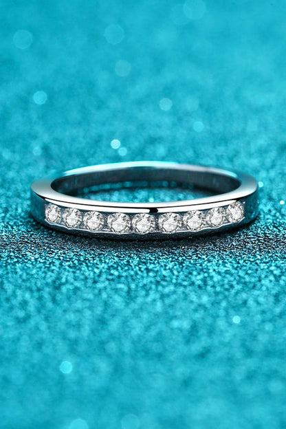 A modern, minimalist 925 sterling silver ring featuring a sparkling moissanite centre stone
