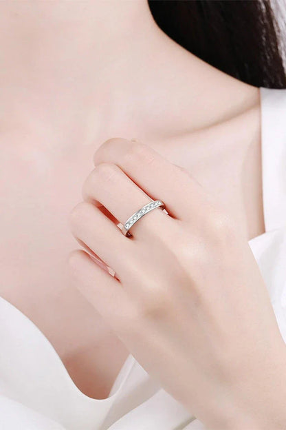 A modern, minimalist 925 sterling silver ring featuring a sparkling moissanite centre stone