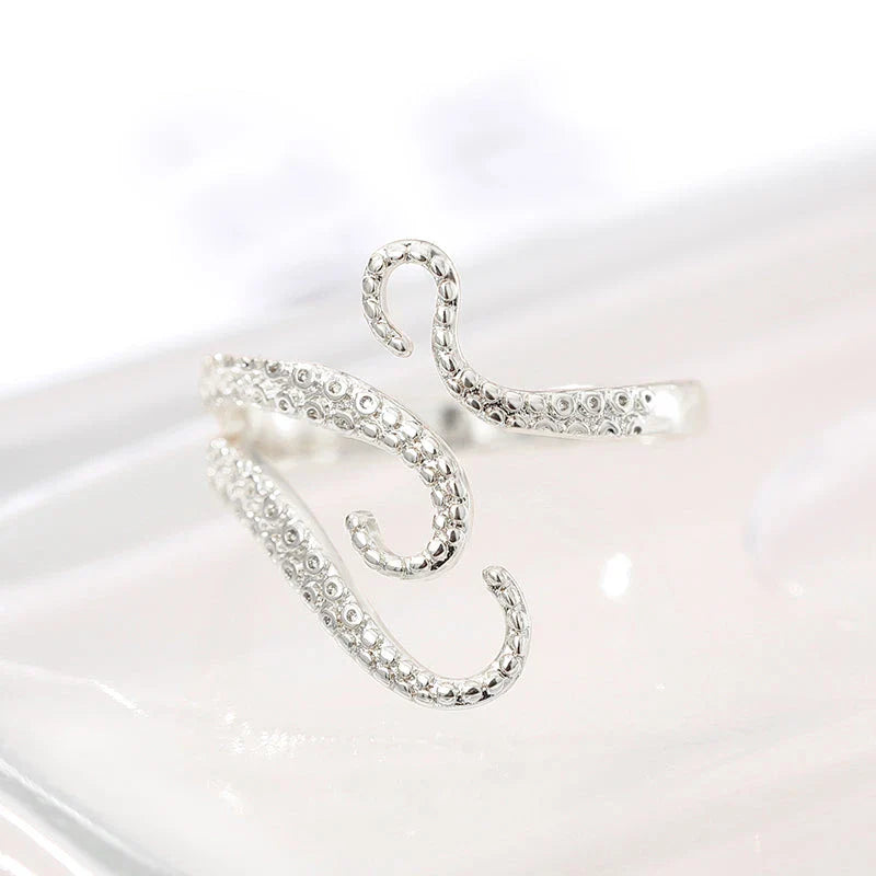 Adjustable octopus tentacle wrap ring made of durable stainless steel with a sleek, elegant design