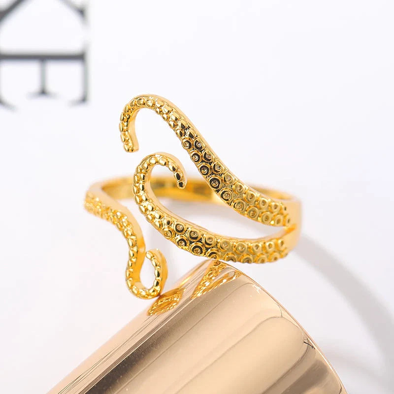 Adjustable octopus tentacle wrap ring made of durable stainless steel with a sleek, elegant design