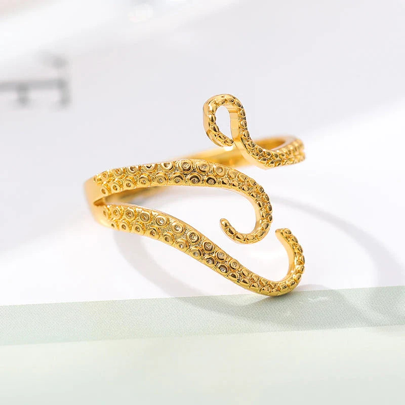 Adjustable octopus tentacle wrap ring made of durable stainless steel with a sleek, elegant design