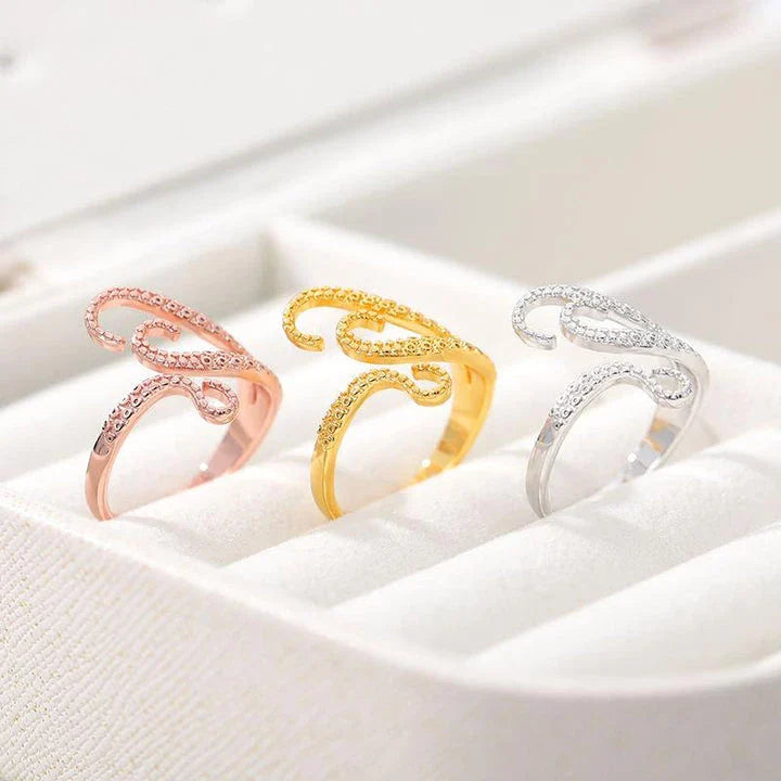 Adjustable octopus tentacle wrap ring made of durable stainless steel with a sleek, elegant design