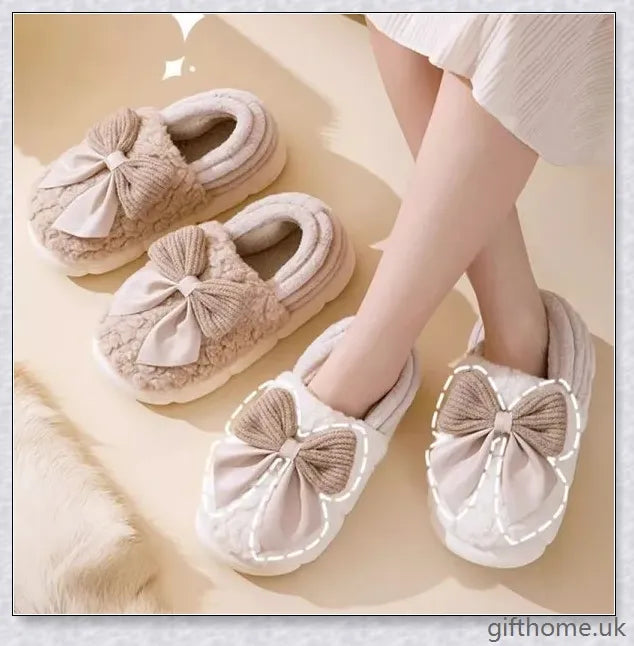 Pair of fluffy, bow-embellished slippers in a soft, suede-like material