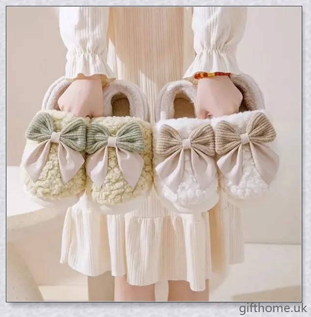 Pair of fluffy, bow-embellished slippers in a soft, suede-like material