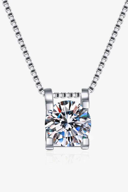 Closeup view of a sparkling 1 carat moissanite gemstone set in a rhodium-plated 925 sterling silver chain necklace