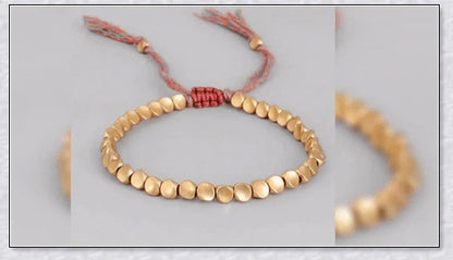 Handmade Tibetan copper bead bracelet with adjustable length and elegant design