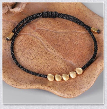 Handmade Tibetan copper bead bracelet with adjustable length and elegant design