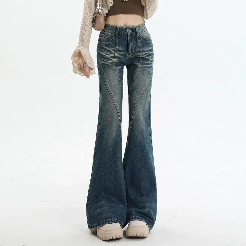 High-waisted flare jeans with a vintage wash, decorative elements, and a flattering silhouette