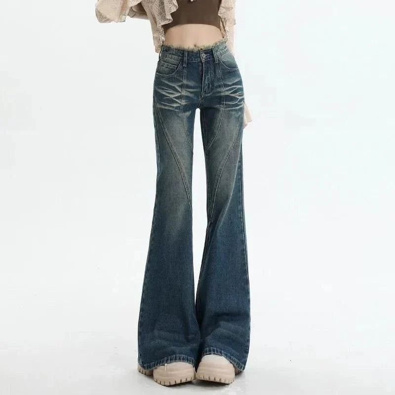 High-waisted flare jeans with a vintage wash, decorative elements, and a flattering silhouette