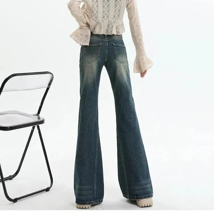 High-waisted flare jeans with a vintage wash, decorative elements, and a flattering silhouette