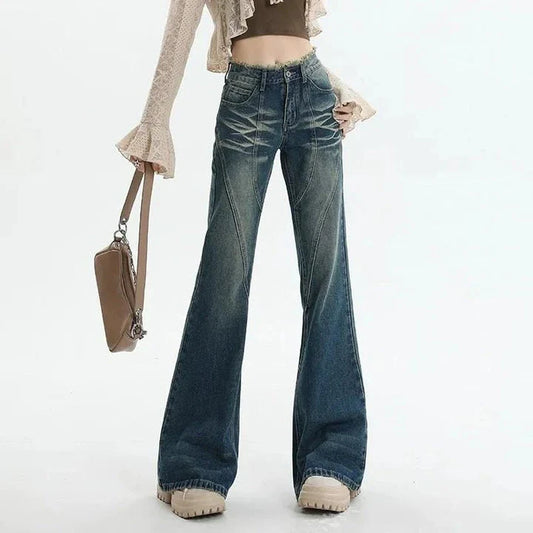 High-waisted flare jeans with a vintage wash, decorative elements, and a flattering silhouette
