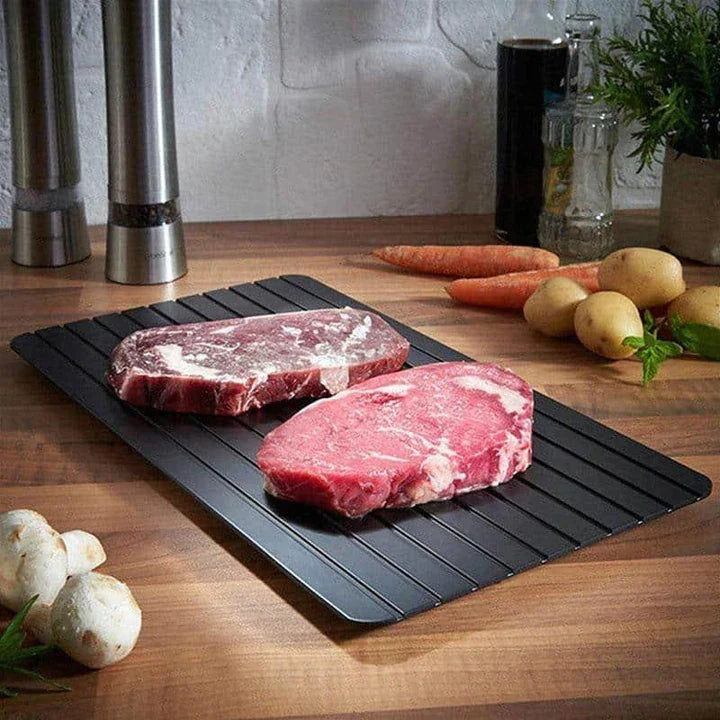 Premium aluminium fast defrosting tray for quick and even thawing of frozen foods, making meal preparation a breeze in the kitchen