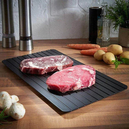 Premium aluminium fast defrosting tray for quick and even thawing of frozen foods, making meal preparation a breeze in the kitchen