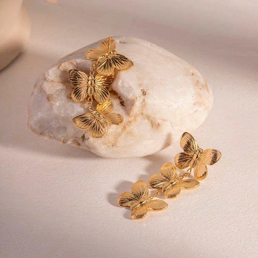 Exquisite stainless steel butterfly stud earrings with 18K gold plating, a chunky and oversized design for a bold statement.
