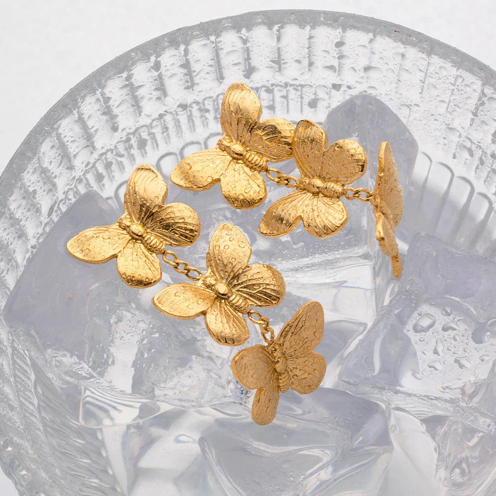 Exquisite stainless steel butterfly stud earrings with 18K gold plating, a chunky and oversized design for a bold statement.