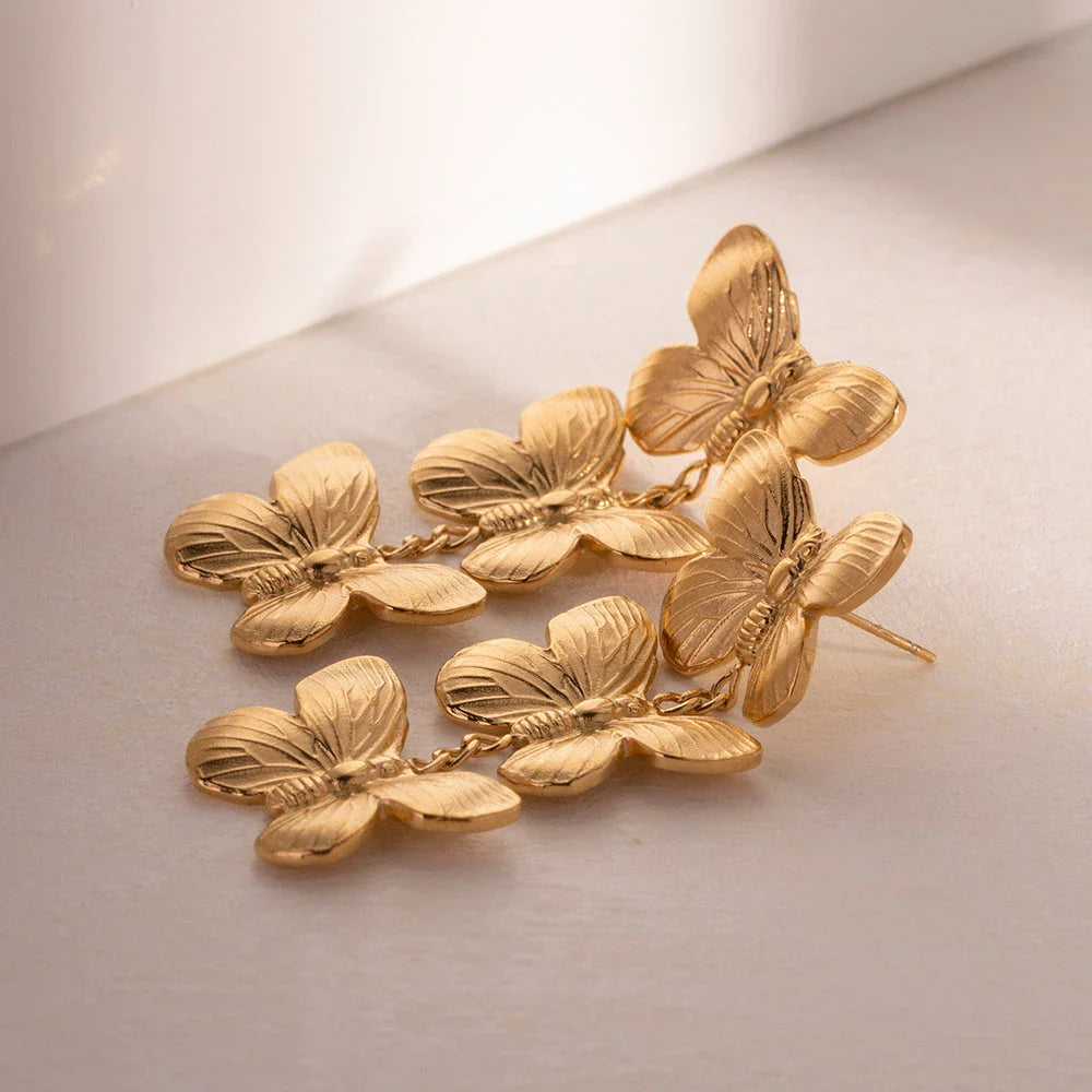 Exquisite stainless steel butterfly stud earrings with 18K gold plating, a chunky and oversized design for a bold statement.