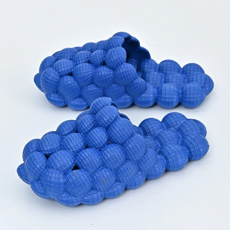 Comfortable massage bubble slides with breathable mesh upper and non-slip soles for indoor relaxation and pampering